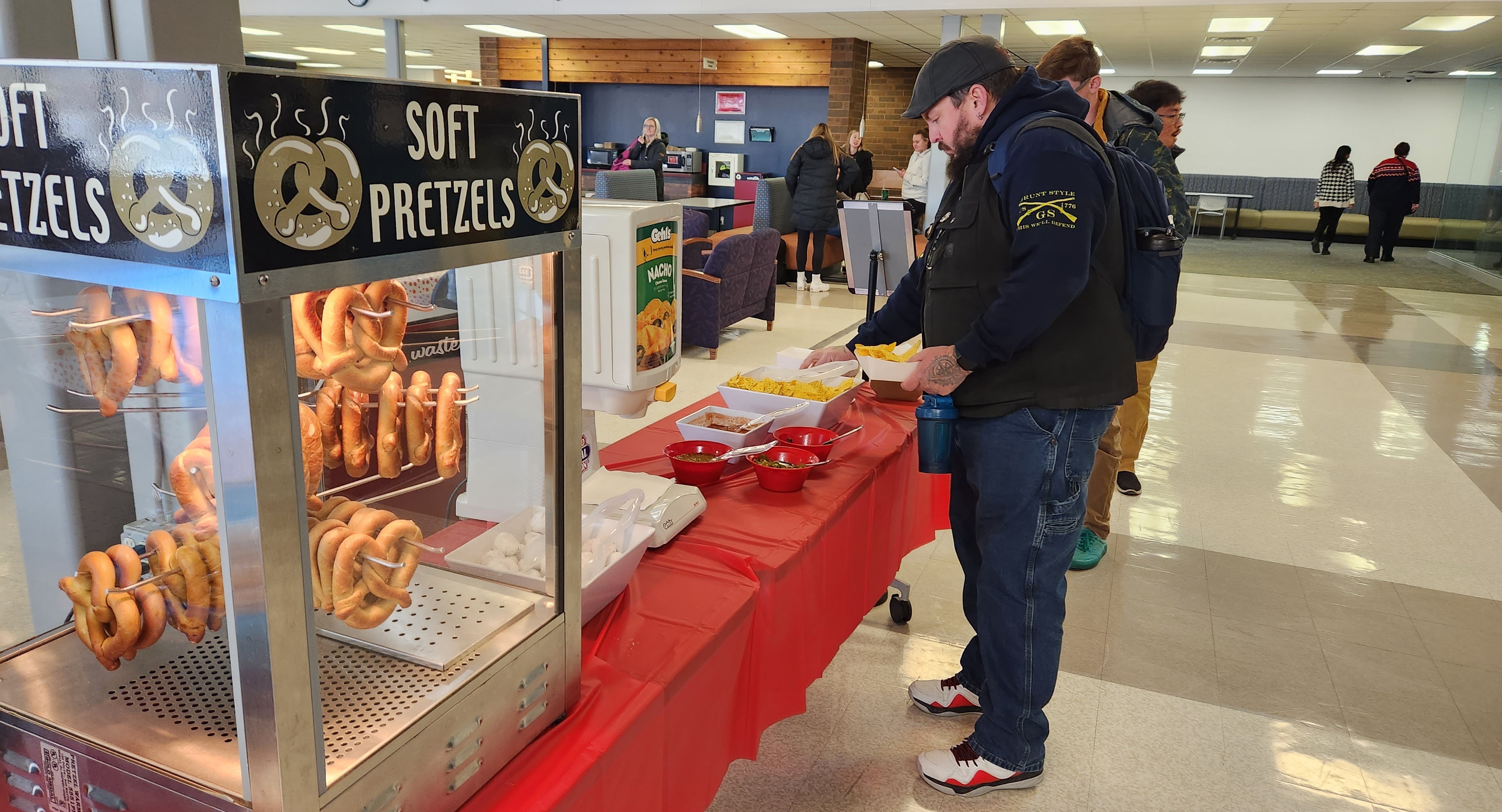 Guy getting some pretzels