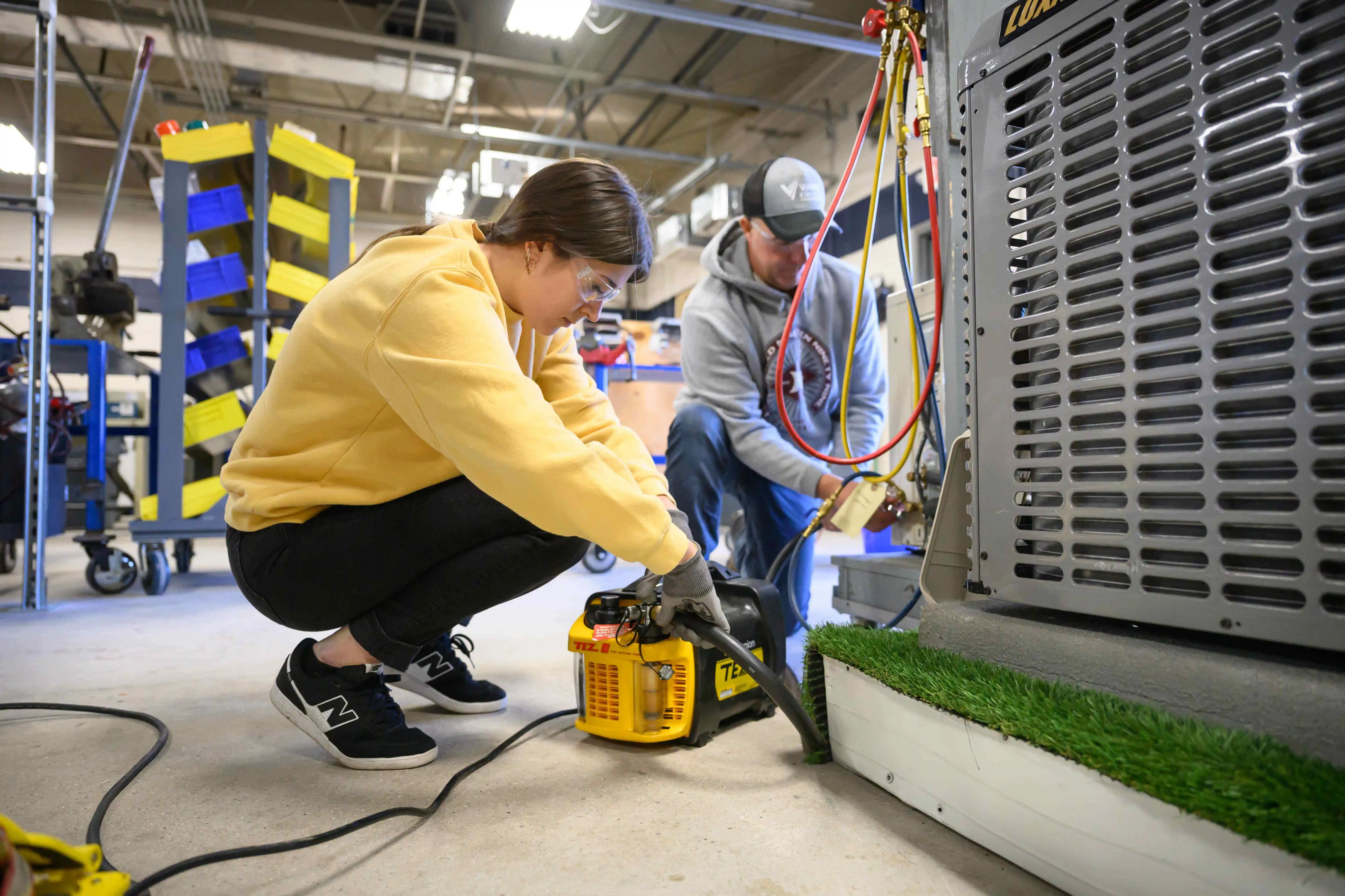 HVAC Students working on a AC unit