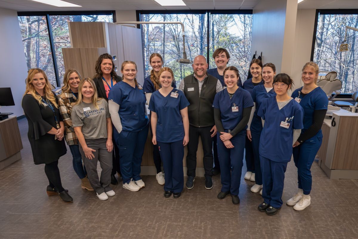 Dr. Paul Carlsen, president of Lakeshore College, center, poses with Lakeshore College faculty and students of the college’s dental program. Photo courtesy of Lakeshore College 