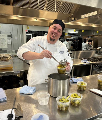 Shawn Engel enjoys his Garde Manger course during the spring 2024 semester.