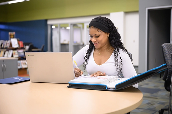 A student working on class assignment from HSED class